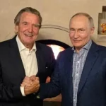 Merz pobúrený Schröderovou návštevou Putina. Oslavu označil za nemorálnu